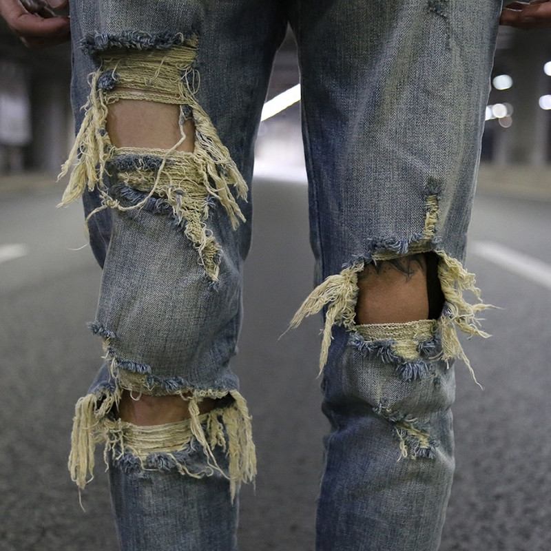 Slim-fit Stretchjeans Med Stora Hål Och Gul Innerdragkedja